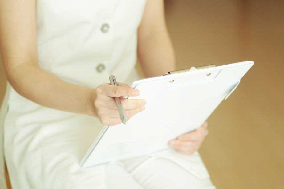 Young woman's aromatherapist counseling patient